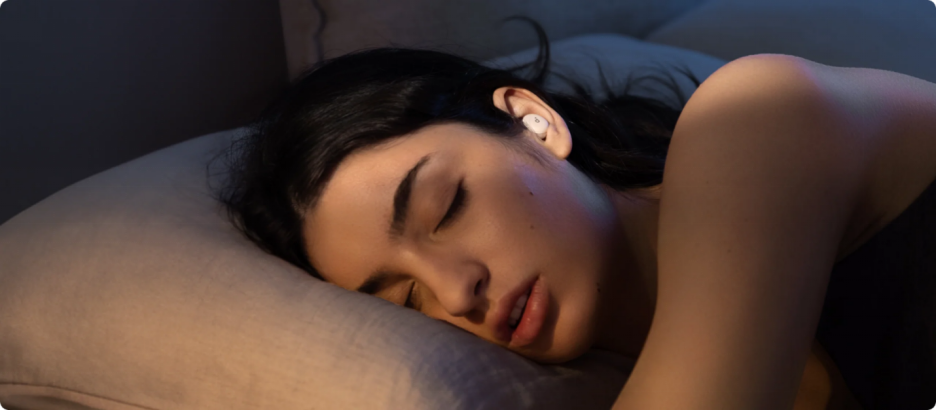 Woman sleeping with headphones on
